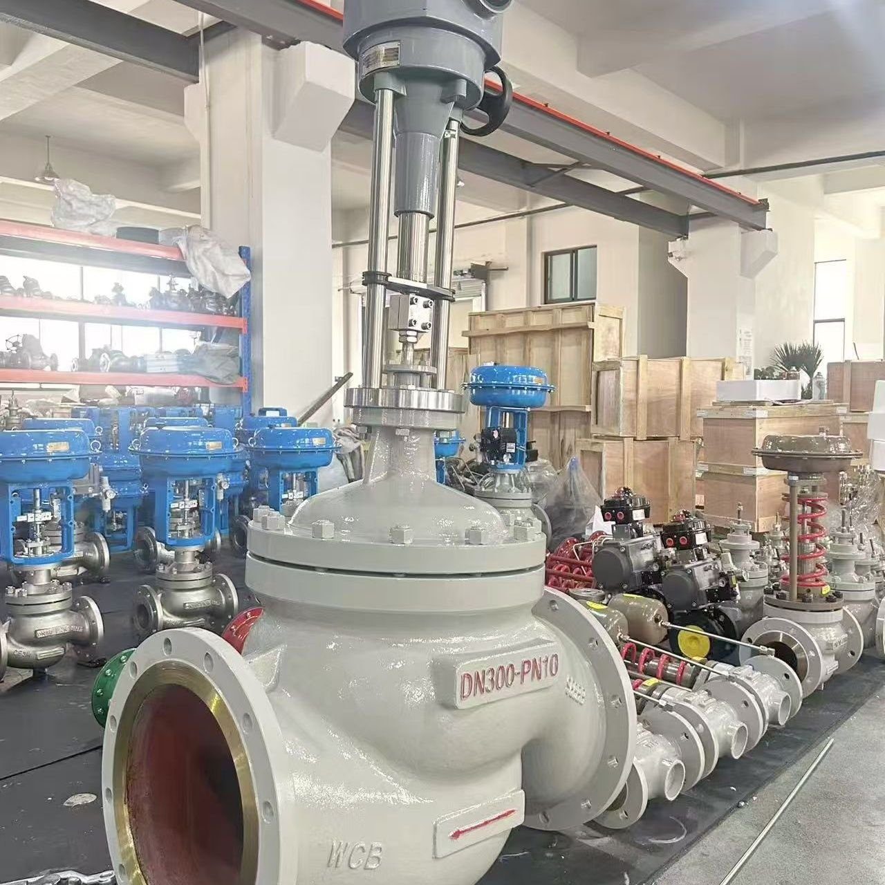 DN300 PN10 large-bore pneumatic control valve with grey actuator in workshop
