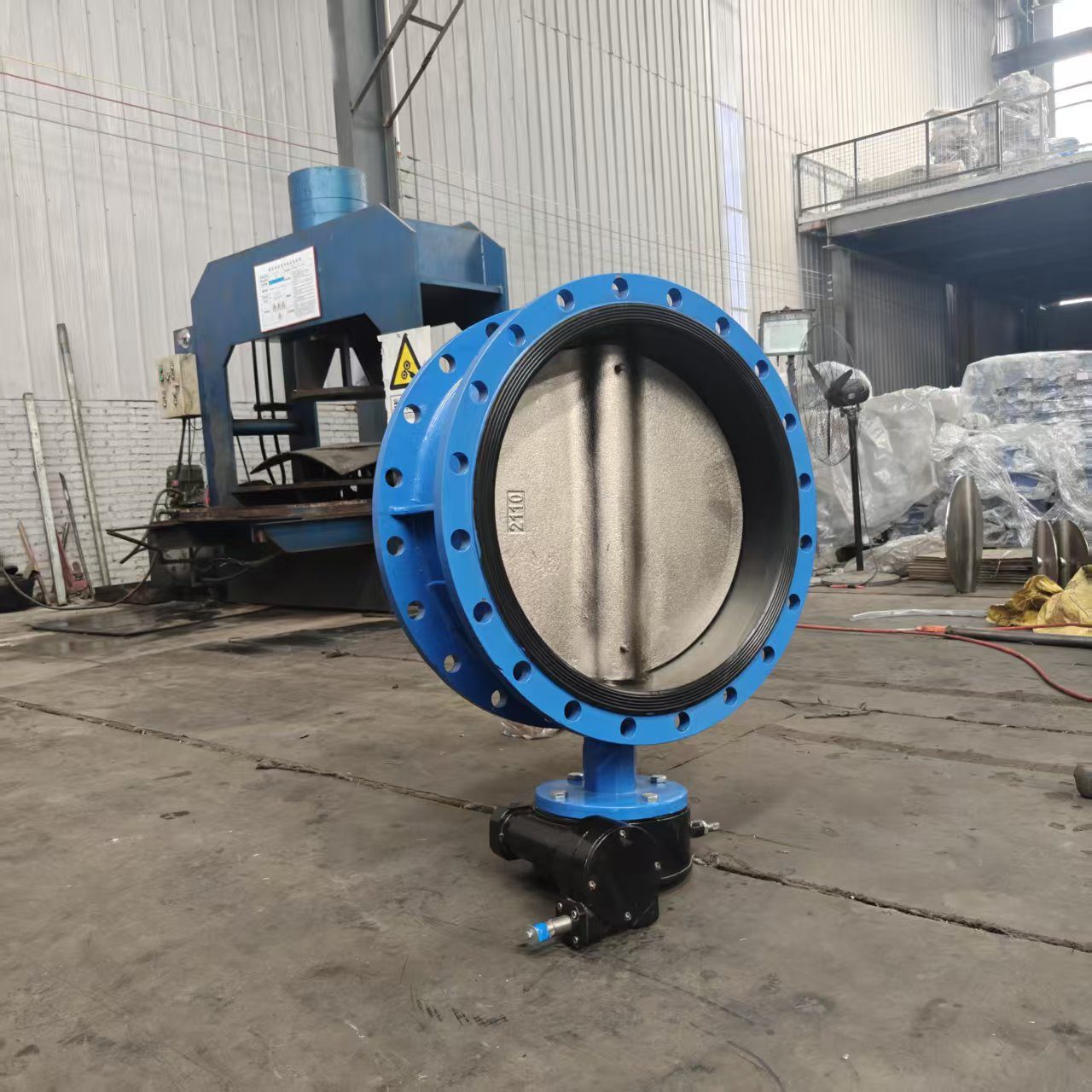 Flanged butterfly valve side view in factory workshop