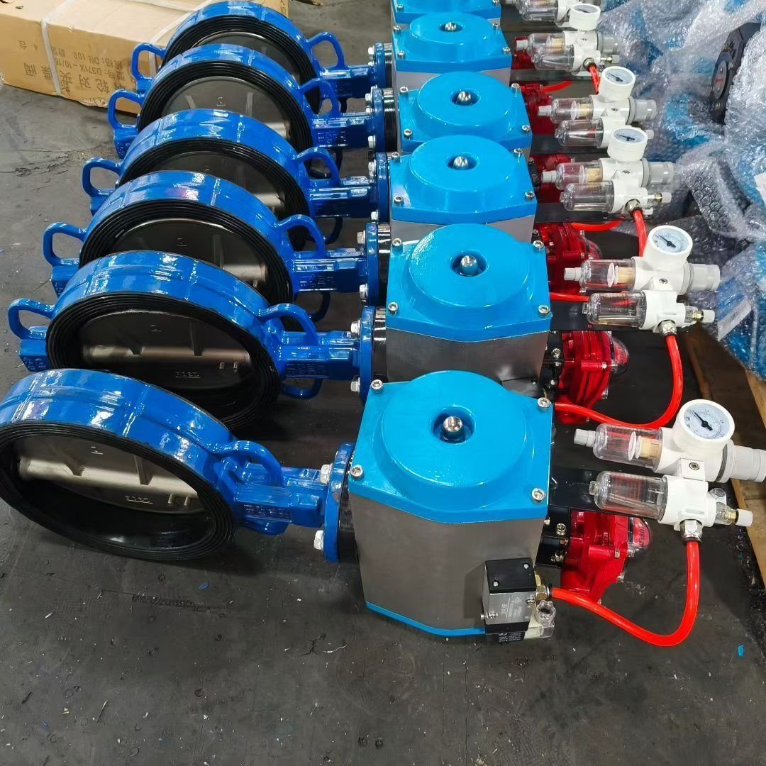 Pneumatic wafer butterfly valves with blue actuators in factory – Reguvale